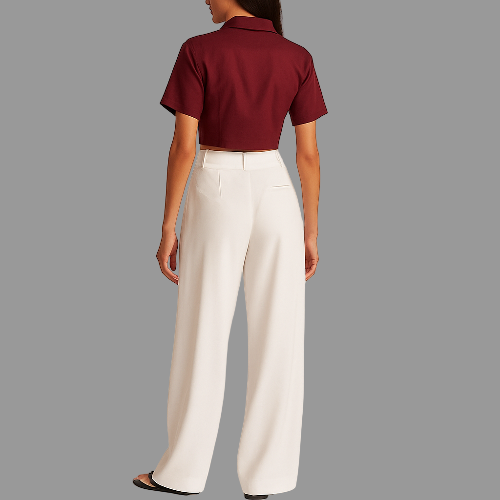 BACK IMAGE OF FEMALE MODEL WEARING WHITE COLOUR LOOSE STRAIGHT FIT WIDE LEGS TROUSER WITH BELT LOOPS AND ONE CUT POCKET AT BACK. MODEL IS WEARING WINE COLOUR CROP SHIRT