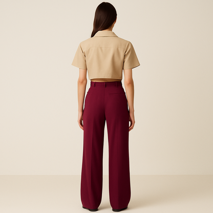 Full BACK IMAGE OF FEMALE MODEL WEARING wine COLOUR LOOSE STRAIGHT FIT WIDE LEGS TROUSER WITH BELT LOOPS AND ONE CUT POCKET AT BACK. MODEL IS WEARING BEIGE COLOUR CROP SHIRT
